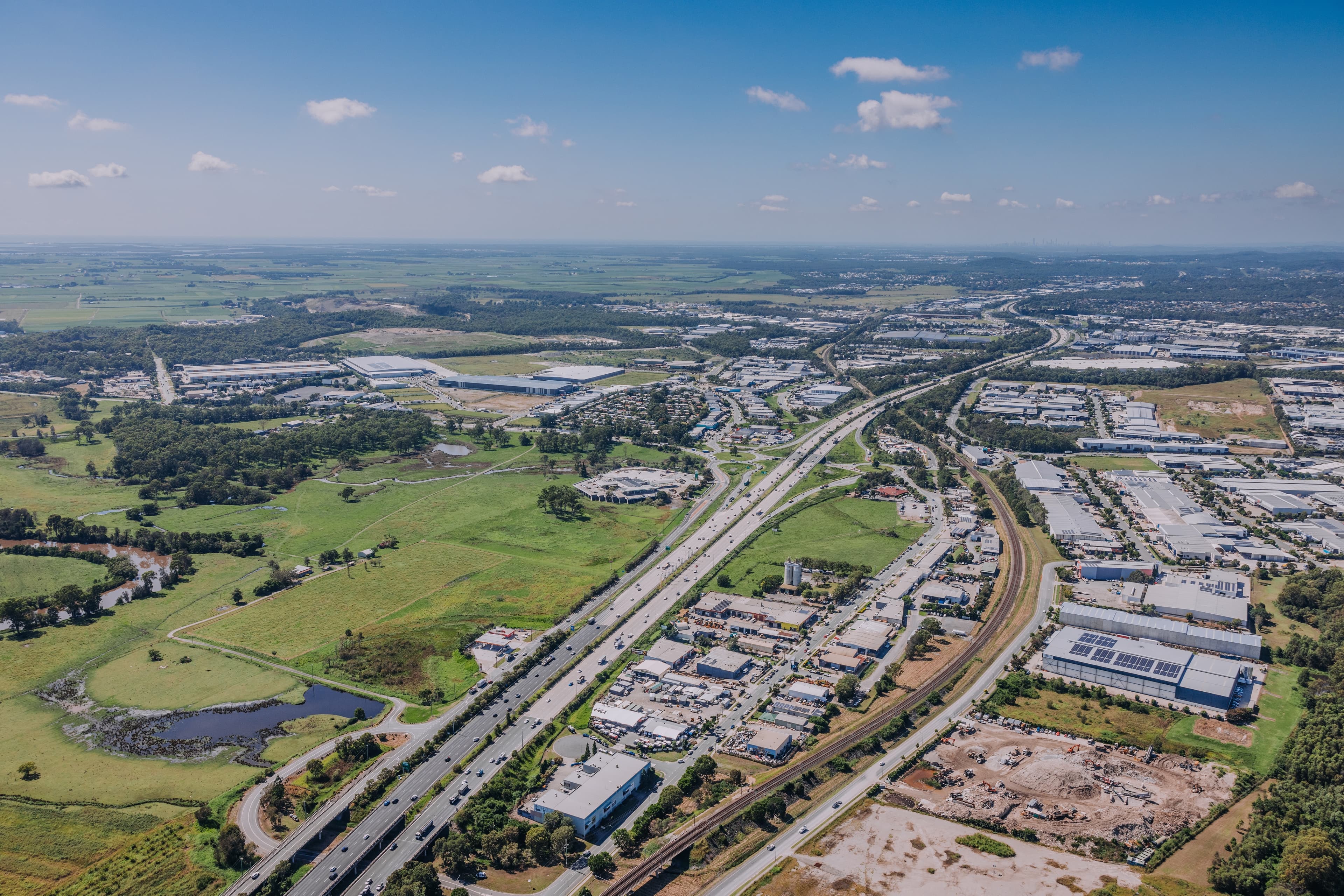 Aerial view of industrial areas and green space on the Gold Coast.
