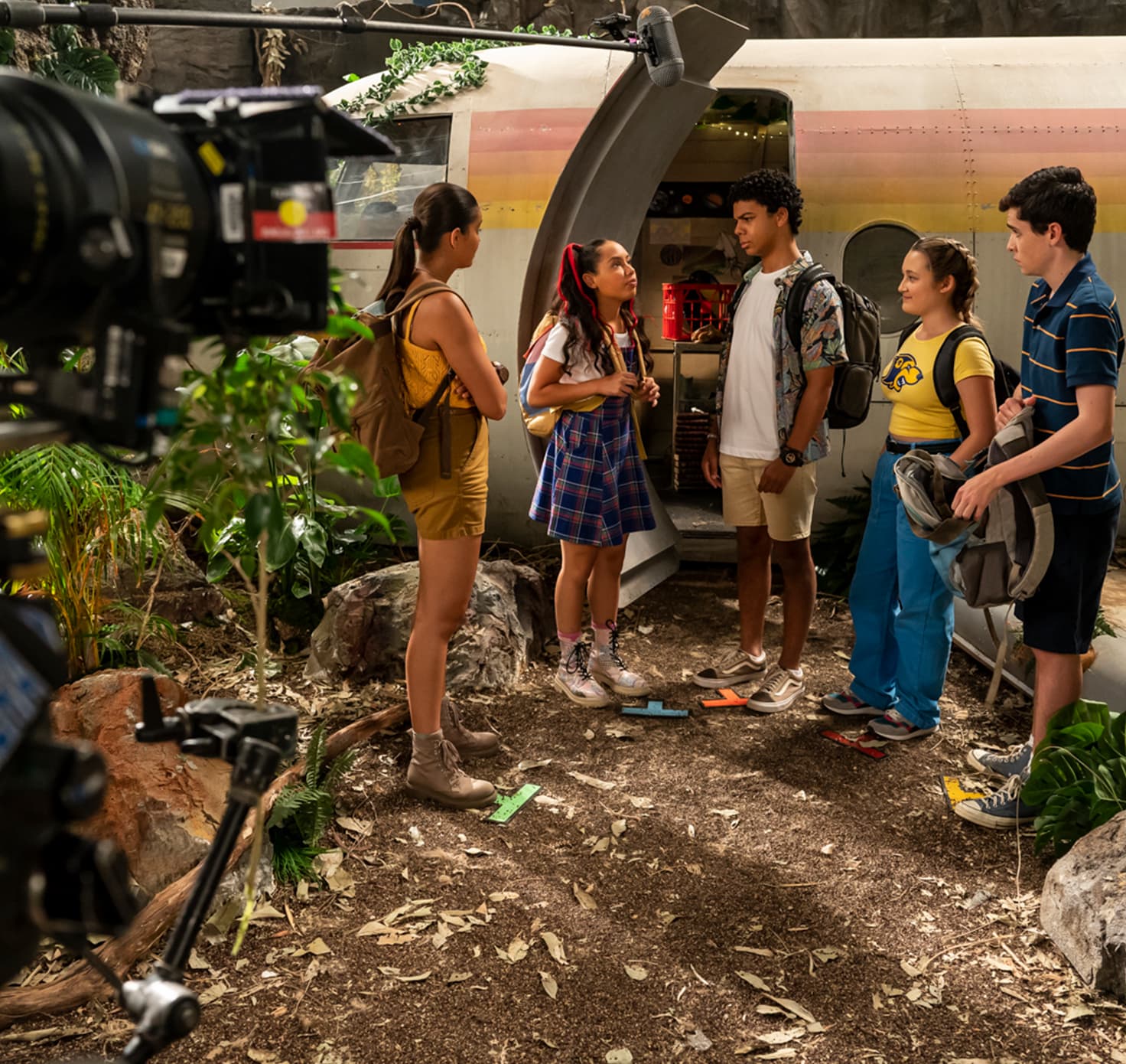 Teenagers filming a television series.